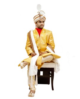 AUM DESIGN FUSION WEAR SHERWANI WITH A BOLD OUT LOOK, USES BRIGHT YELLOW AS COLOR BOARD